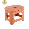 Foldable Plastic Yellow Square Stool in Living Room